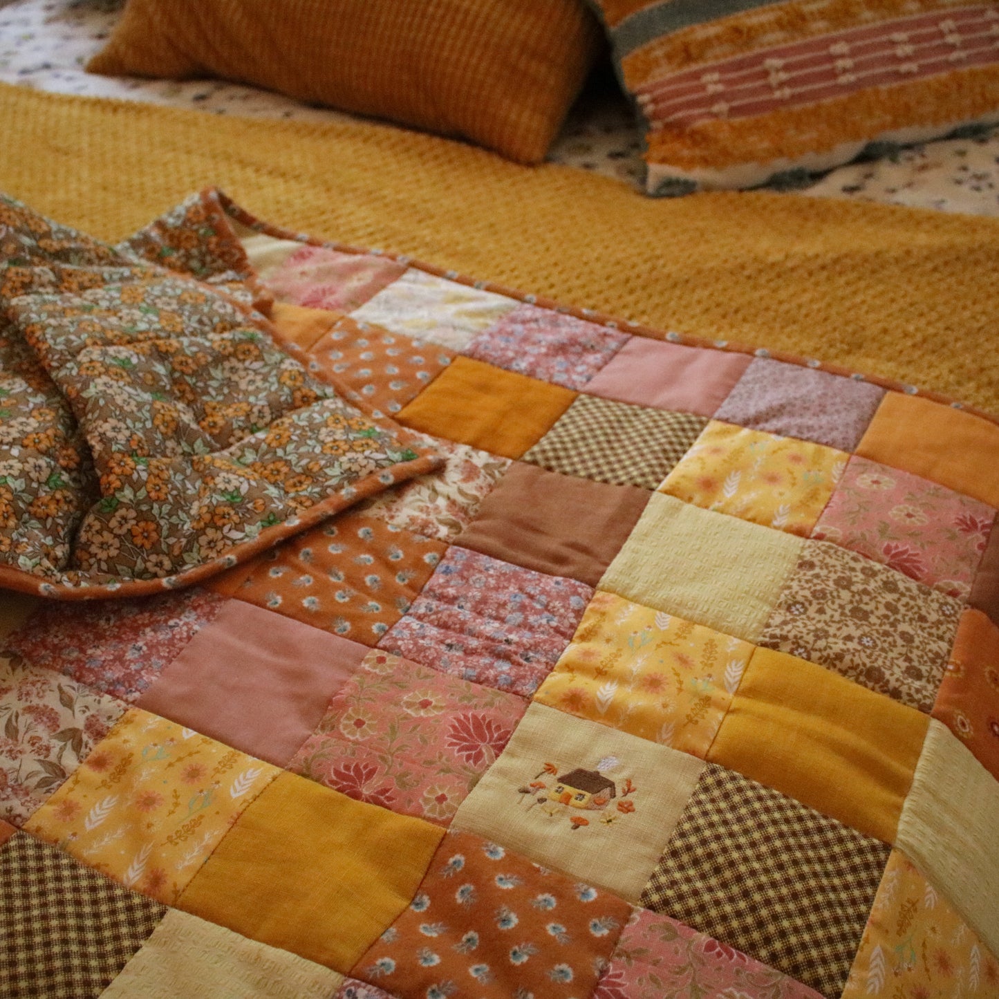 Heirloom Patchwork Bed Runner with an Embroidery "Marigold"
